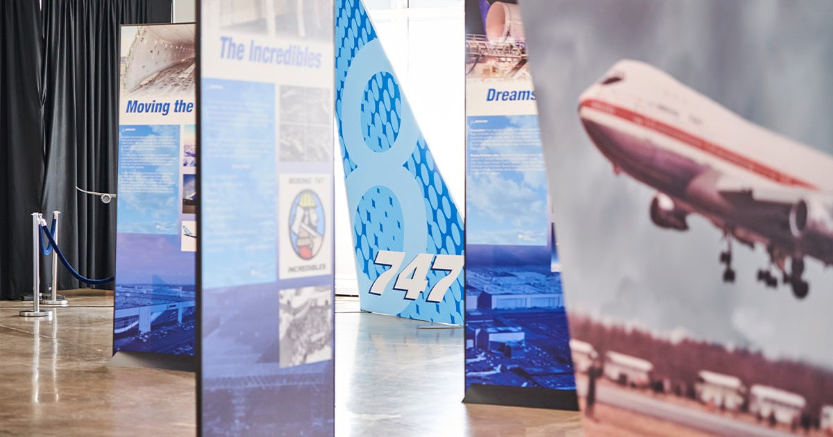 A glimpse into the Boeing 747 exhibit, which features tall, 8 foot-plus vertical signs with information about the Boeing 747 on each side. 