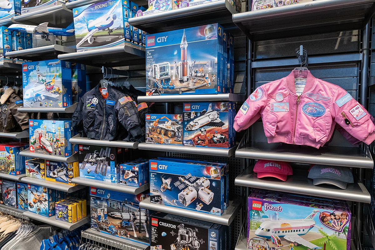 Toys, hats, and kids clothing on display on racks