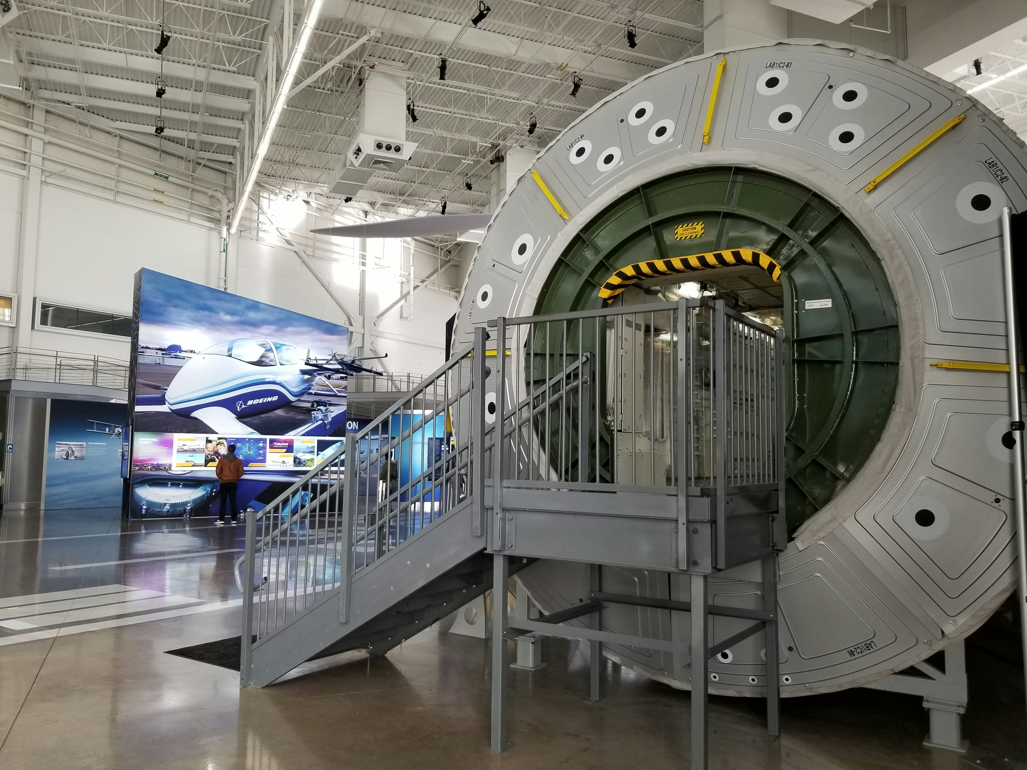 A staircase leading up into the entrance of our destiny module exhibit.